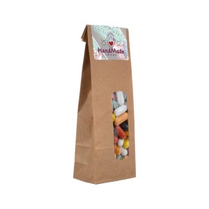 Kraftpapierbeutel mit Bonbons und Etikett 100g
